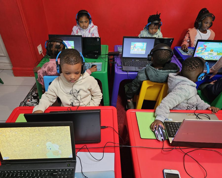Children at the computers at Little Toddlers Creche