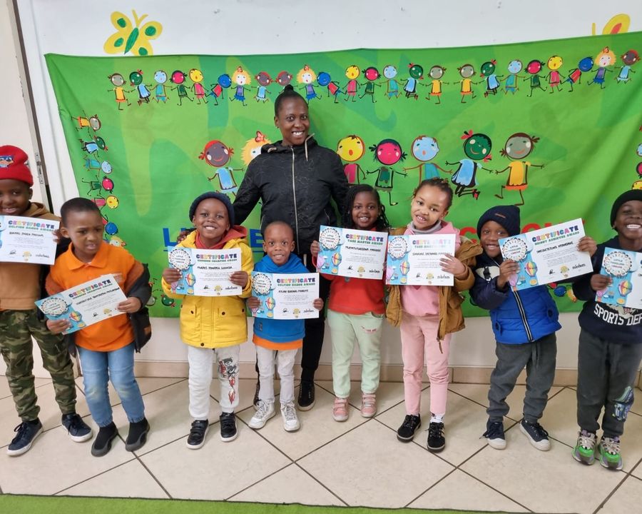 Children celebrating with their certificates at Little Toddlers Creche
